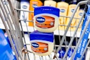 two containers of Vaseline petroleum jelly in a Walmart cart