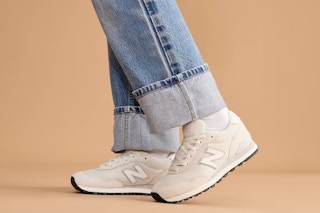 someone wearing a pair of new balance shoes