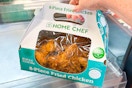 hand holding a box of home chef fried chicken