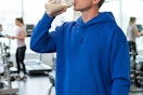 a man drinking a protein shake