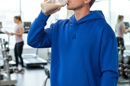 a man drinking a protein shake