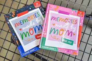2 mom and me memory books in a cart