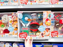 hand holding little tikes creative chefs kit on walmart shelf