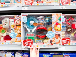 hand holding little tikes creative chefs kit on walmart shelf