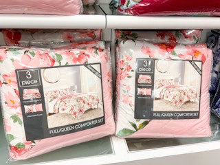 Pink floral 3-piece comforter sets on shelf