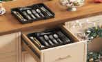silverware in an organizer in a drawer