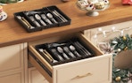 silverware in an organizer in a drawer