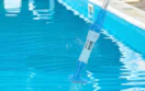 a cordless pool vacuum in a pool