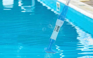 a cordless pool vacuum in a pool