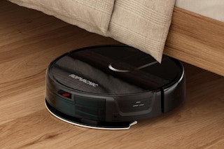 a robot vacuum under a bed