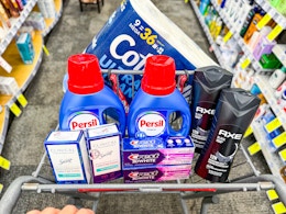 cvs shopping cart with persil, axe, secret, crest, axe, cottonelle