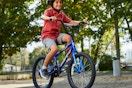 lifestyle image of a child riding a bike