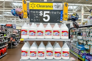 Multiple gallons of Cra-Z-Art Glue on end shelf at Walmart with $5 clearance sign