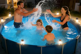 family enjoying pool in the evening