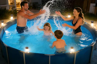 family enjoying pool in the evening