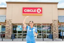a nurse outside of Circle K with a drink
