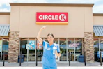 a nurse outside of Circle K with a drink