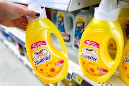 hand holding suavitel fabric softener