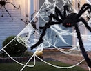 a fake spider and web in front of a house