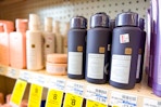 kristin ess hair care on a store shelf with sale tags