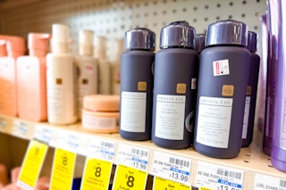 kristin ess hair care on a store shelf with sale tags
