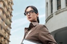 a woman wearing blue light blocking smart glasses