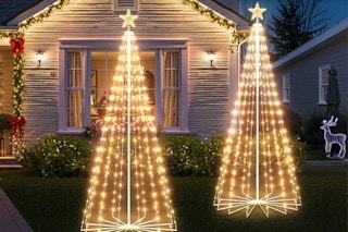 Brightown Christmas Cone Tree Light sitting in a front yard during winter.