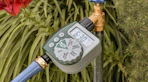 a watering timer connected a faucet and hose
