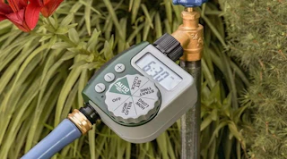 a watering timer connected a faucet and hose