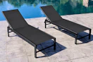 Lifestyle image of the Lowe's Crestlive Chaise Lounge Set set up by a pool