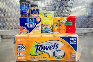 member's mark products in front of a shopping cart including paper towels, snacks, and more