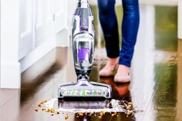 Lifestyle image of the BISSELL CrossWave Turbo Pet Pro Multi-Surface Wet-Dry Vacuum cleaning up spilt cereal