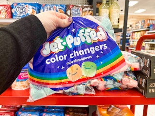 Someone holding a bag of Jet Puffed Color Changers marshmallows in Target