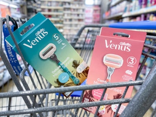 A box of Venus Miami Sunset and Venus Miami sunrise razors sitting in the front of a shopping cart.