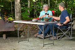 couple sitting outside drinking wine at table