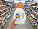 hand holding all free and clear laundry detergent in walgreens