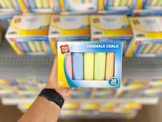 hand holding play day sidewalk chalk at walmart