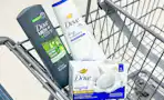 dove body wash and bar soap in a cart