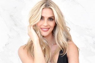 A woman with styled hair smiling