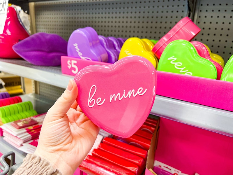 hand holding a heart tin at walmart