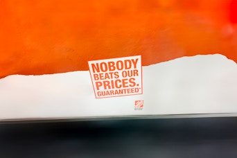 a logo on the Home Depot price match poster that says "Nobody Beats Our Prices, Guaranteed*"