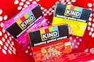 mixed berry, strawberry banana, and pineapple mango KIND bars in a Target basket