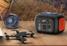 a power station charging a drone and fan on a patio