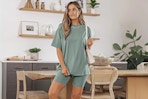 Lifestyle image of woman wearing the SUNBS 2 Piece Outfit for Women Lounge Set in light green 
