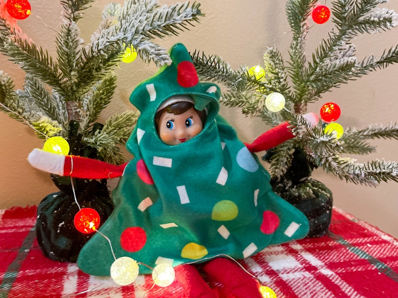 elf on the shelf doll in tree costume