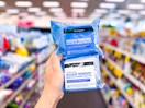 hand holding two neutrogena makeup wipe packs