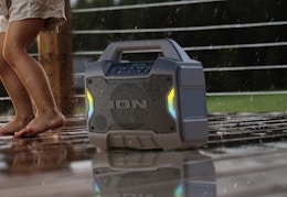 black bluetooth speaker outside in the rain