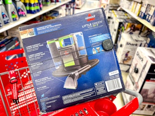 bissel little green max pet carpet cleaner sitting on a target cart