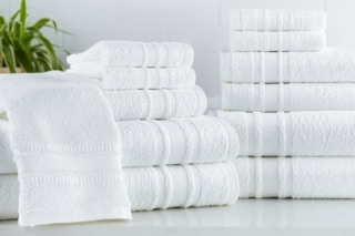 Lifestyle image of the white 100% cotton 12-piece towel set (Mainstays)