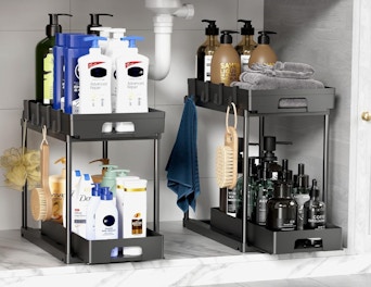two organizers under a sink with beauty products